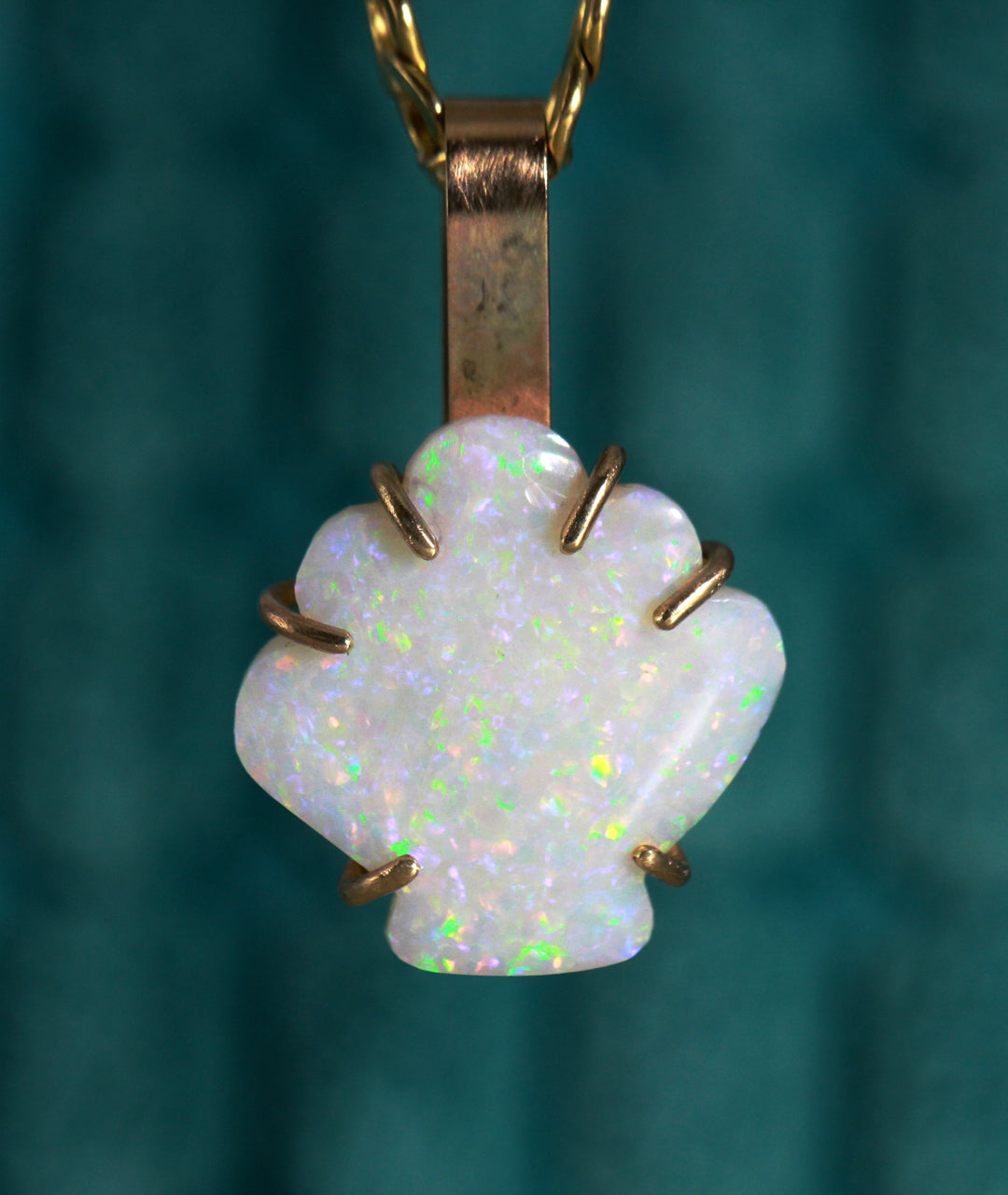 White Opal from Coober Pedy Australia, hand cut into the shape of a mermaid shell. 