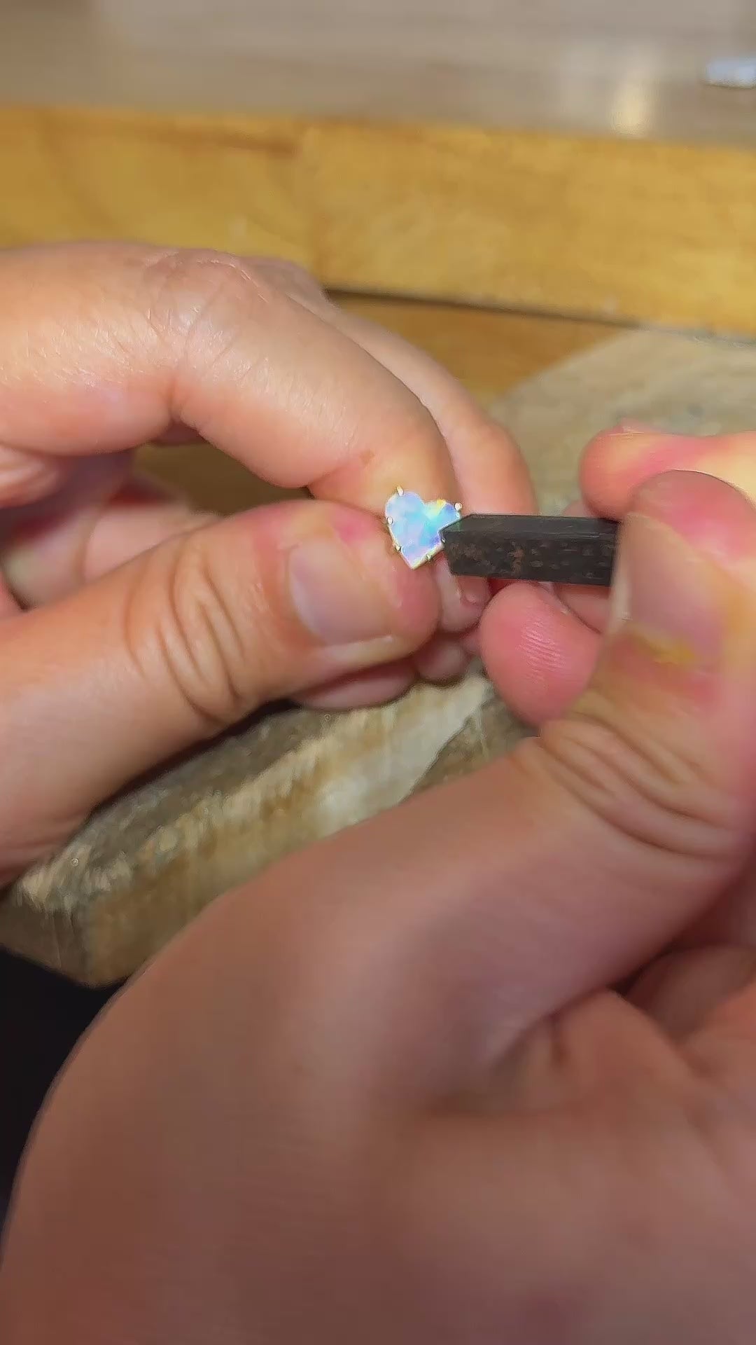 Process of setting the Rainbow Heart natural Australian crystal opal solid gold ring. 