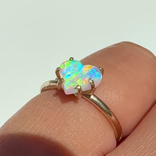 Wearing the Rainbow Heart natural Australian crystal opal solid gold ring in the sunlight. 